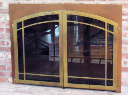 The Hingham Window-pane (Arch top window- pane bar)  Ancient aged patina frame, painted antique brass finish vice bi fold window-pane doors and smoked glass. Comes with slide mesh.